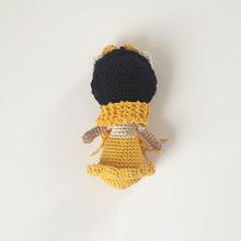 yellow small doll
